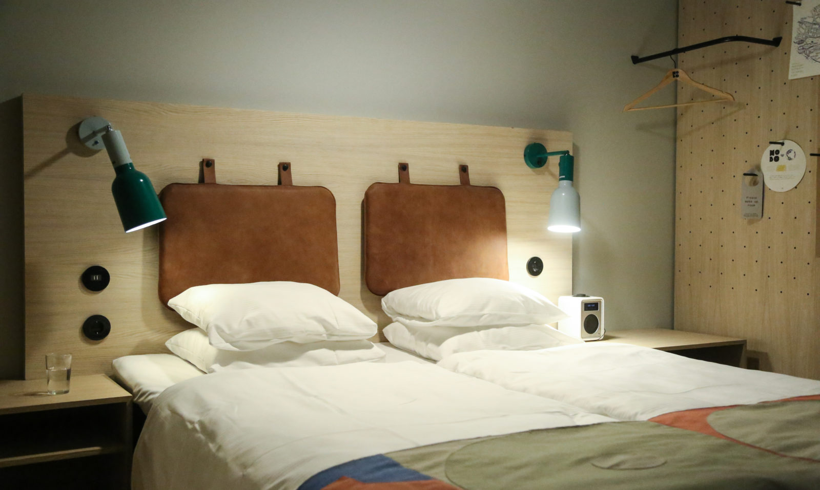 Smaller room with bed with white fresh sheets at Hobo Hotel in Stockholm